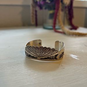 Silver kokopelli cuff